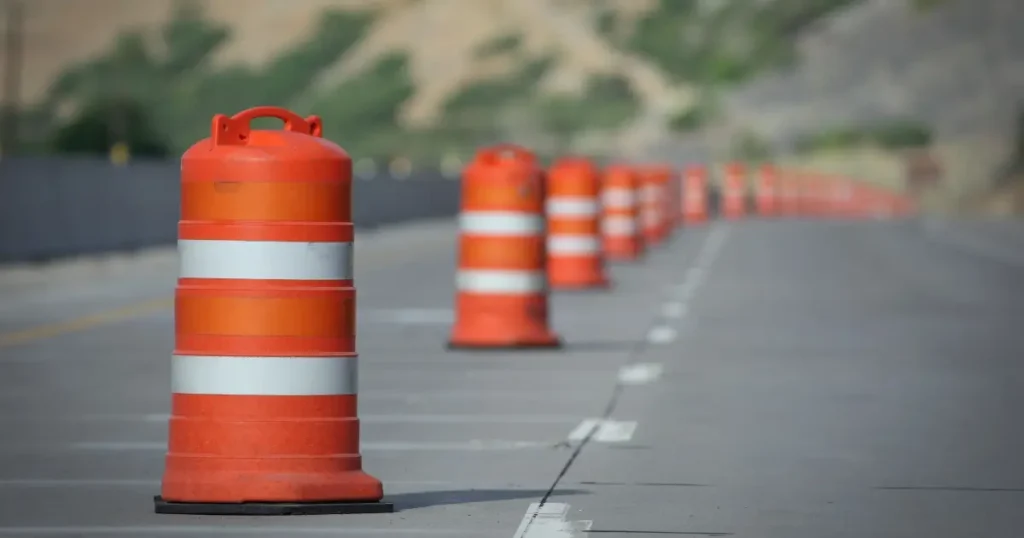 Current image: Orange barrels set up for road construction