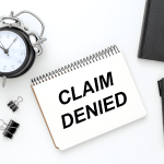 Current image: Claim Denied Written on Notepad Social