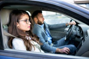 driver and passenger on the road