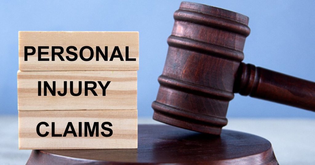 Current image: gavel next to wood blocks that say personal injury claims